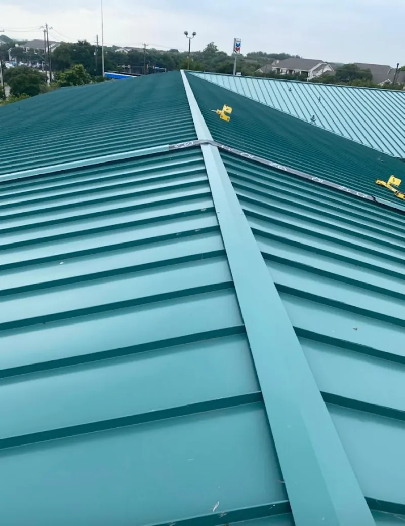 Green commercial metal roof ridge and valley for Metal Roof Repair in Sugar Land