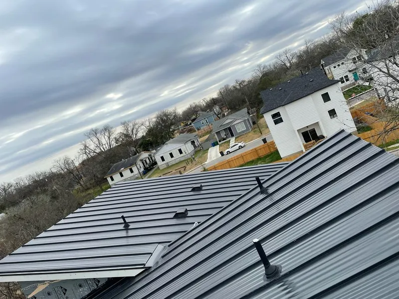Standing seam metal roof panels with vents for Skylight Repair in Sugar Land
